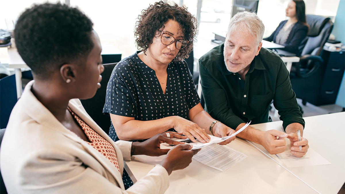 People discussing a recruiting contract