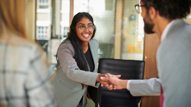 Woman accepting a job offer who had a great candidate experience