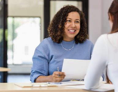 A woman interviewing another woman