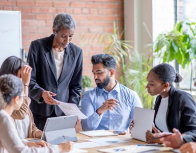 People sitting around a conference table discussing change